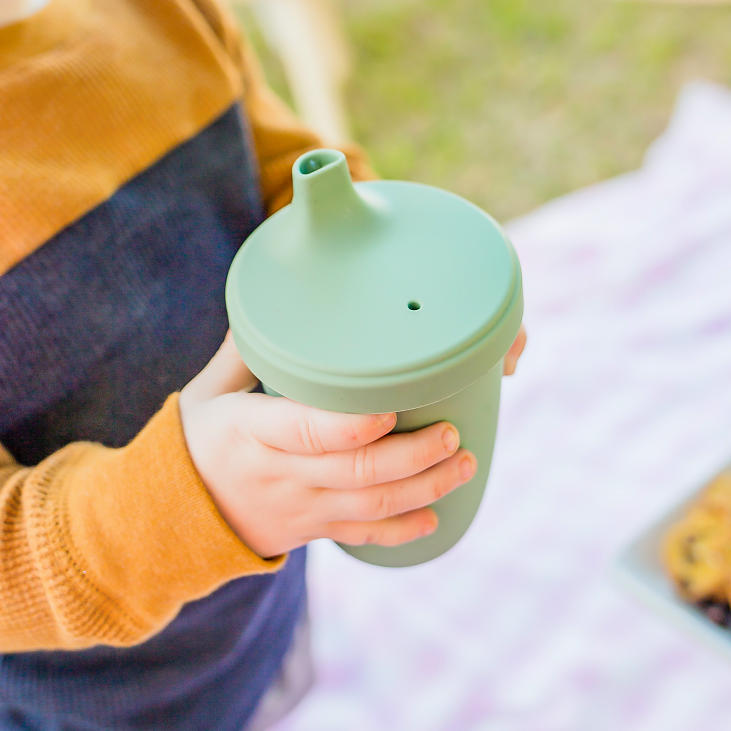 https://re-play.com/cdn/shop/files/8-oz-silicone-sippy-cup-rainbow--lifestyle__002.png?v=1698236784